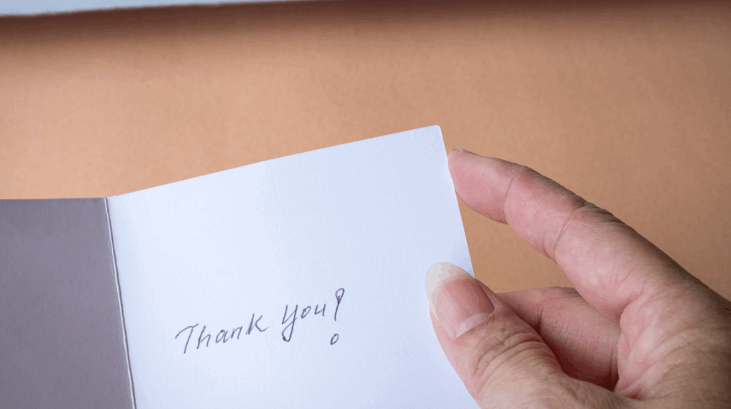 Close-up of a handwritten thank-you note to a nurse.