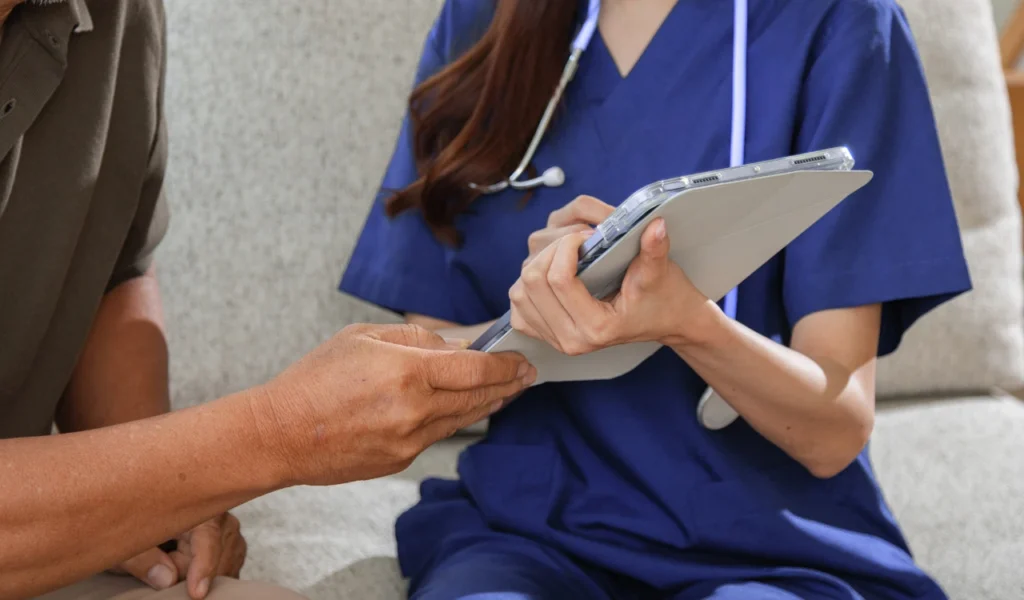Nurse communicating with a patient and family member during a hospital stay | CHCM