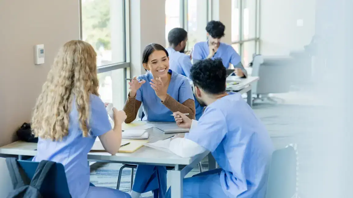 Nurses participating in shared governance meeting