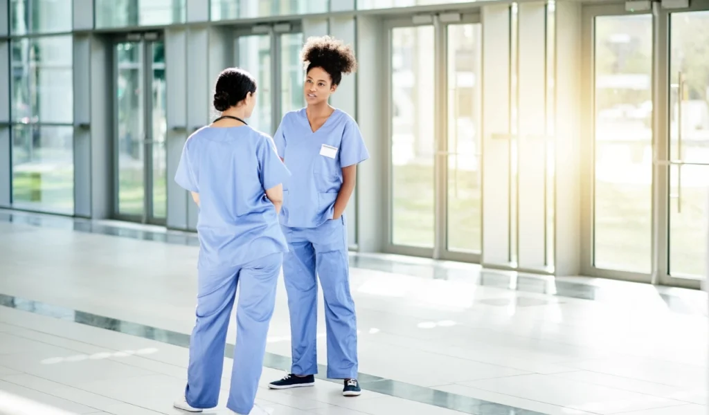 Nurses discussing patient care and sharing clinical expertise | CHCM