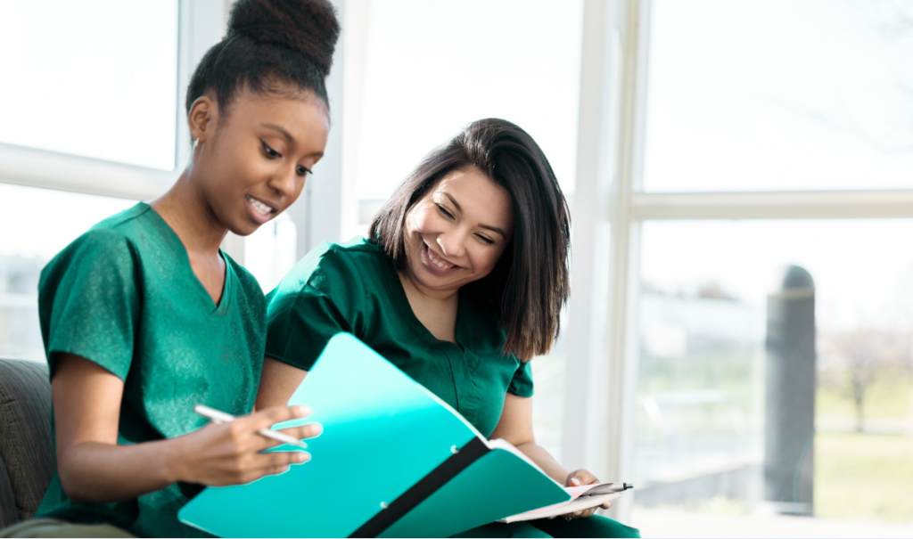 Nursing leaders collaborating on writing a Magnet® document using the 2023 Magnet® Manual | CHCM