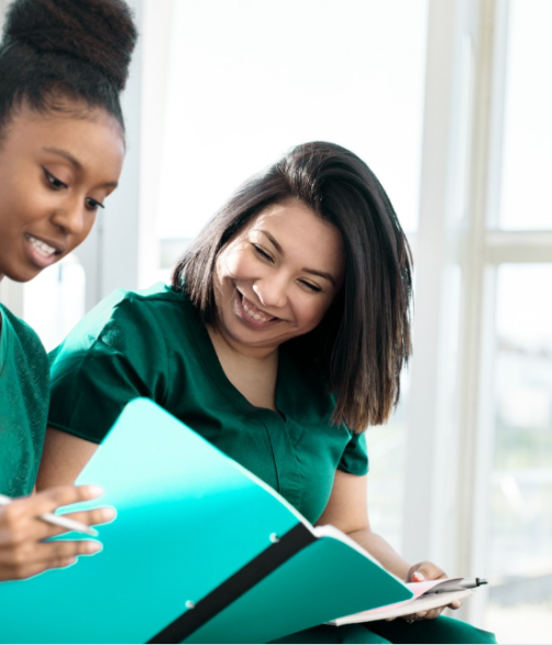Nursing leaders collaborating on writing a Magnet® document using the 2023 Magnet® Manual | CHCM