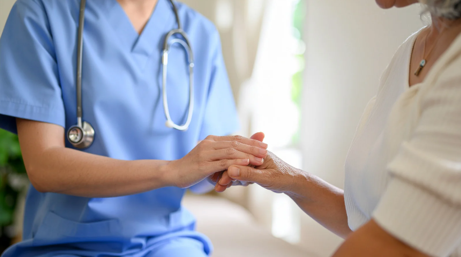 Care team supporting a patient while demonstrating compassion, teamwork, and relational leadership.