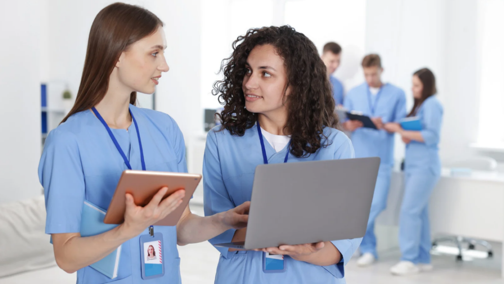 Nurses discussing patient care during a team huddle 