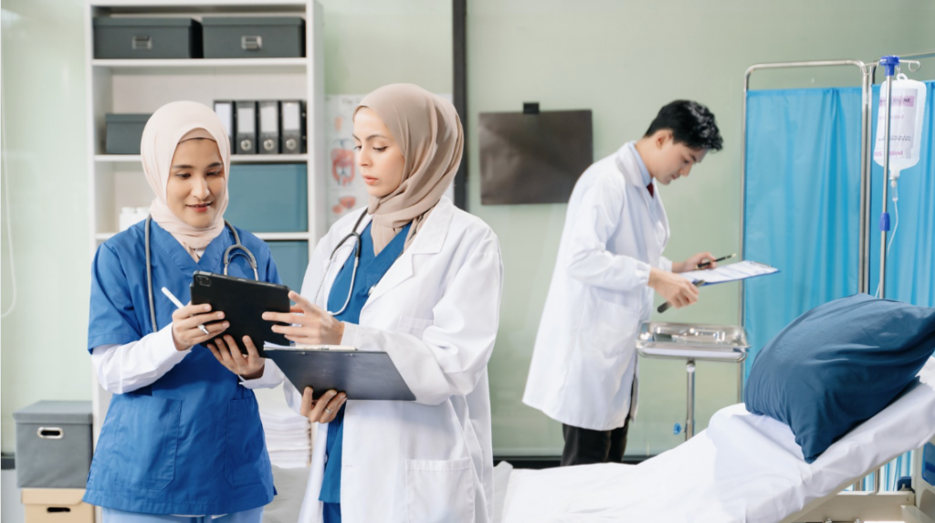 Interprofessional healthcare team collaborating during a patient care discussion | CHCM  