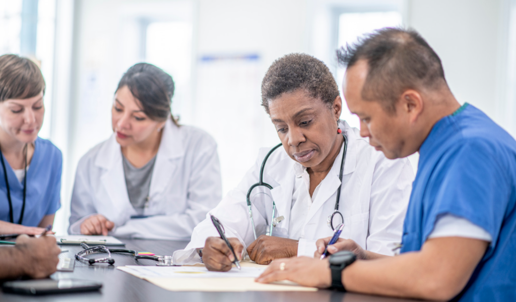 Interdisciplinary clinical team reviewing patient care outcomes | CHCM