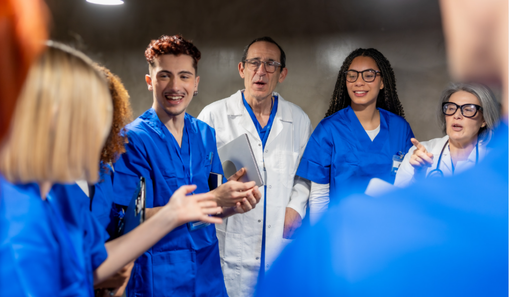 Healthcare employee speaking up during a team meeting in a psychologically safe workplace | CHCM