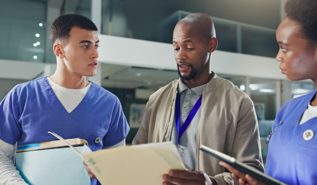 Nurse leaders and healthcare professionals collaborating during a Magnet® designation planning meeting focused on nursing excellence and patient outcomes. | CHCM