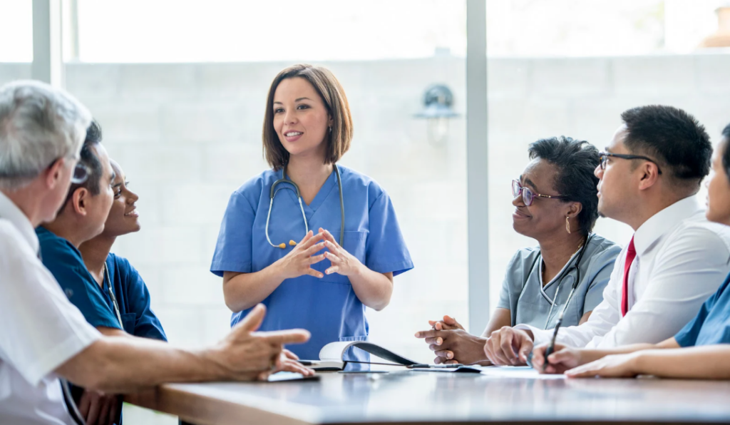 Professional governance council meeting with nurse leaders discussing shared decision-making and nursing excellence initiatives | CHCM 
