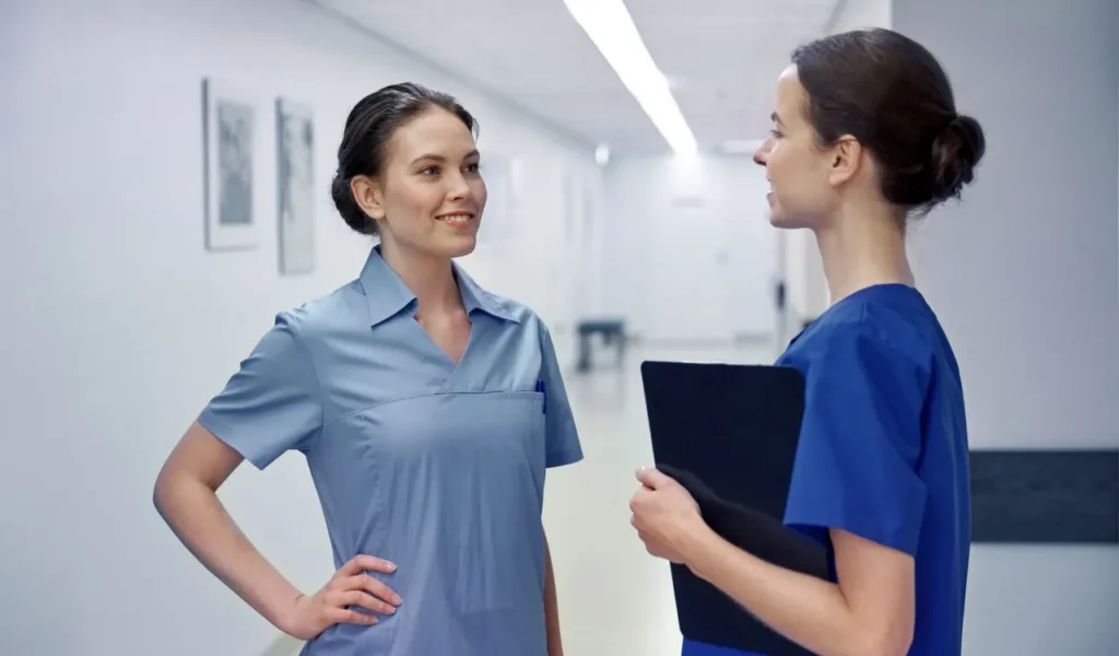 Nurse leader mentoring an emerging council chair during a professional governance meeting | CHCM 
