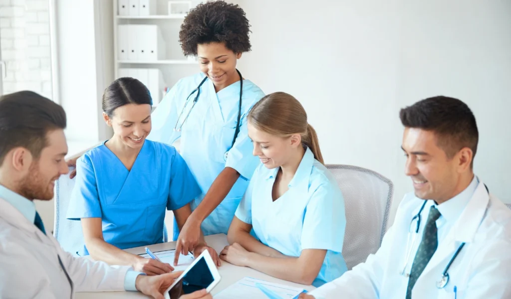 Nurse leader facilitating a professional governance council meeting focused on shared decision-making | CHCM