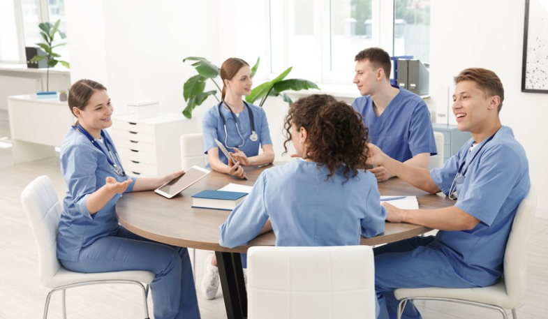 Healthcare team collaborating through shared decision-making to strengthen nurse engagement. | CHCM 