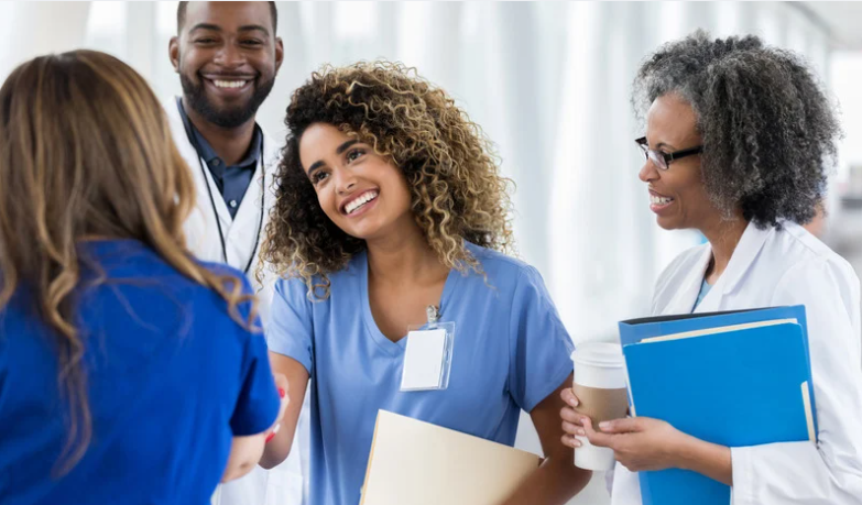 Hospital leader recognizing a nurse's contributions as part of a low-cost employee engagement strategy.  | CHCM 