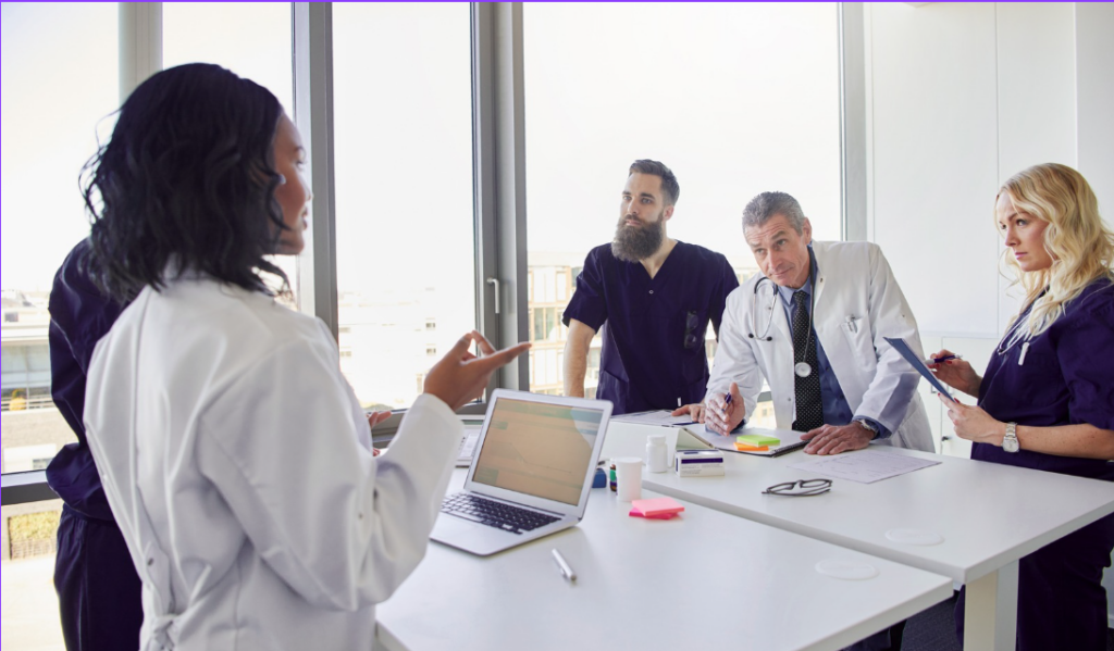 Hospital leadership discussing healthcare performance data during strategic planning | CHCM 