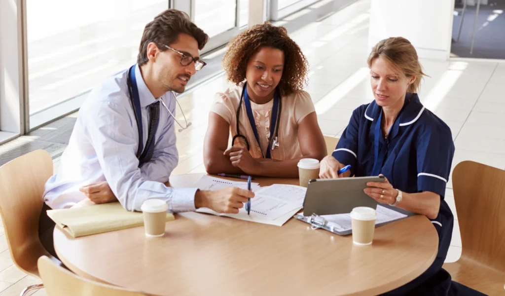 Nurse leader listening to nurses discuss barriers to professional autonomy | CHCM