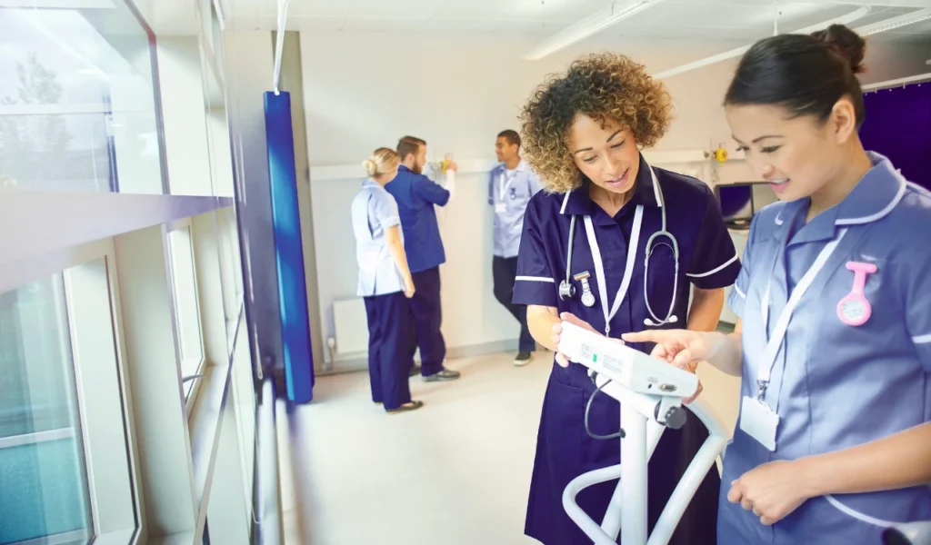 Nurses collaborating with a healthcare leader to strengthen nurse voice and organizational excellence | CHCM 