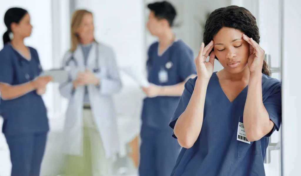 Healthcare team experiencing signs of communication breakdown during a staff meeting | CHCM