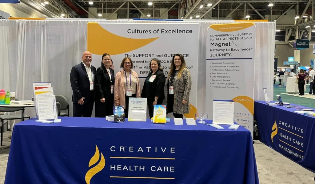 Creative Health Care Management team welcoming nursing leaders at Booth 1054 in Chicago | CHCM