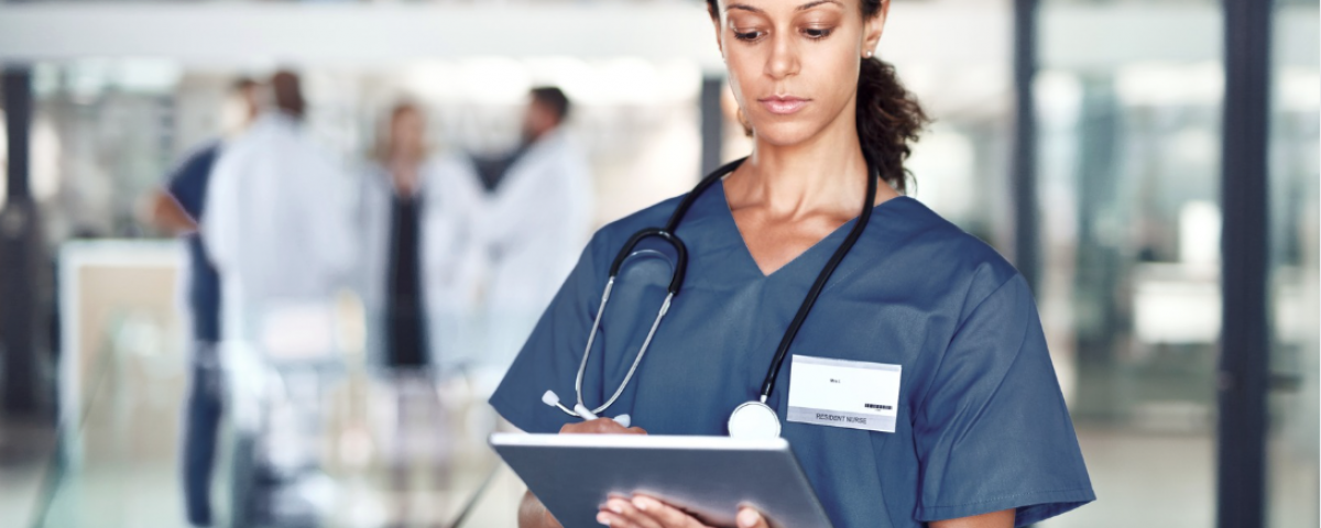 Nurse leader collaborating with staff nurses on a nursing research project in a healthcare organization | CHCM